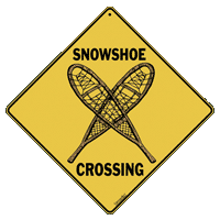 Image of snowshoer crossing sign