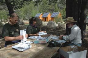 Image of volunteers preparing Snowlands Bulletin